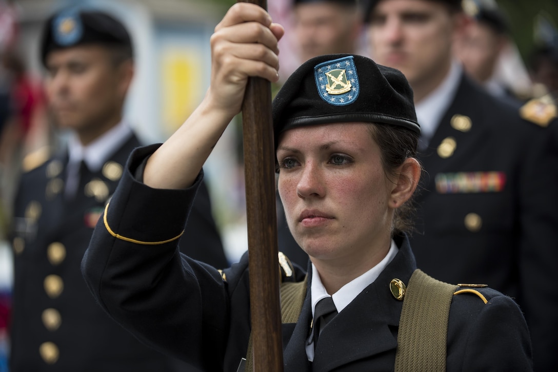 Sgt. Brittany Albanese, with the 443rd Military Police Command, holds the guidon for the 200th Military Police Command during a march along Constitution Avenue in the 2016 National Memorial Day Parade in Washington, D.C., May 30. The Soldiers in formation were from the 200th MP Cmd., from Fort Meade, Maryland; the 55th Sustainment Brigade, from Fort Belvoir, Virginia; and the Military Intelligence Readiness Command, from Fort Belvoir. (U.S. Army photo by Master Sgt. Michel Sauret)