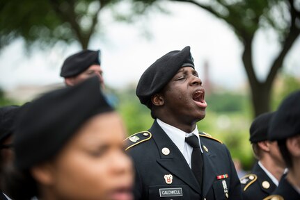 A U.S. Army Reserve Soldier from the 200th Military Police Command, from Fort Meade, Maryland, calls out cadence in formation while marching along Constitution Avenue in the 2016 National Memorial Day Parade in Washington, D.C., May 30. Other Soldiers in formation were from the 55th Sustainment Brigade, from Fort Belvoir, Virginia; and the Military Intelligence Readiness Command, from Fort Belvoir. (U.S. Army photo by Master Sgt. Michel Sauret)