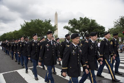 Approximately a hundred U.S. Army Reserve Soldiers march along Constitution Avenue in the 2016 National Memorial Day Parade in Washington, D.C., May 30. The Soldiers in formation were from the 200th Military Police Command, from Fort Meade, Maryland; the 55th Sustainment Brigade, from Fort Belvoir, Virginia; and the Military Intelligence Readiness Command, from Fort Belvoir. (U.S. Army photo by Master Sgt. Michel Sauret)