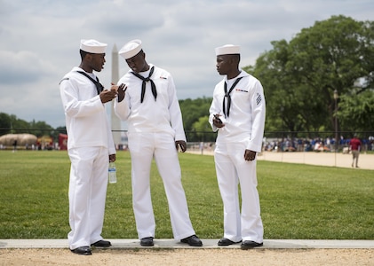 Three U.S. Navy sailors hang out at the National Mall before the start of the 2016 National Memorial Day Parade in Washington, D.C., May 30. (U.S. Army photo by Master Sgt. Michel Sauret)