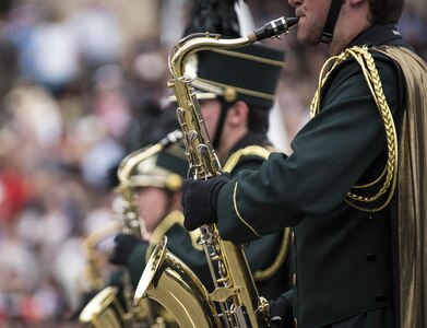 A high school marching band performs along Constitution Avenue in the 2016 National Memorial Day Parade in Washington, D.C., May 30. Approximately a hundred U.S. Army Reserve Soldiers marched in this year's parade, represented by the 200th Military Police Command, from Fort Meade, Maryland; the 55th Sustainment Brigade, from Fort Belvoir, Virginia; and the Military Intelligence Readiness Command, from Fort Belvoir. (U.S. Army photo by Master Sgt. Michel Sauret)