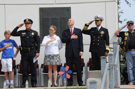 U.S. Navy Adm. Cecil D. Haney, U.S. Strategic Command (USSTRATCOM) commander (second from right), and Nebraska Governor Pete Ricketts (third from right) pay respect to the American flag during the Heroes of the Heartland Foundation Memorial Day event at Memorial Park, Omaha, Neb., May 30, 2016. During the event, Haney and Ricketts joined other state and national government leaders, veterans and members of the Omaha-area community in recognizing the courage, legacy and service of those who gave their lives to guarantee the freedoms and liberties Americans enjoy today. Haney also provided remarks, during which he thanked current and former service members and their families for keeping the nation safe and reminded attendees to remember, respect and honor those who made the ultimate sacrifice. The tradition of honoring fallen war veterans dates back to May 5, 1868 - three years after the Civil War ended - when the head of the Grand Army of the Republic, an organization of Union veterans, established "Decoration Day" as a time for the nation to decorate the graves of the war dead with flowers. The first large observance was held at Arlington National Cemetery, Virginia. In 1971, Memorial Day was declared a national holiday by an act of Congress and was placed on the last Monday of May. (USSTRATCOM photo by Steve Cunningham)\r\nMore photos at: https://www.flickr.com/photos/usstratcom/albums/72157668754772521