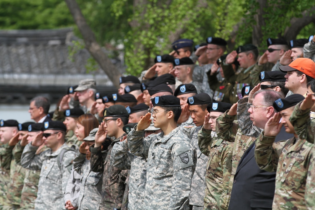 Service Members of the United Nations Command, Combined Forces Command and U.S. Forces Korea render a salute during a repatriation ceremony on the Knight Field, April 28. (U.S. Army photo by Sgt. Choi, Woo Hyuk/Released)