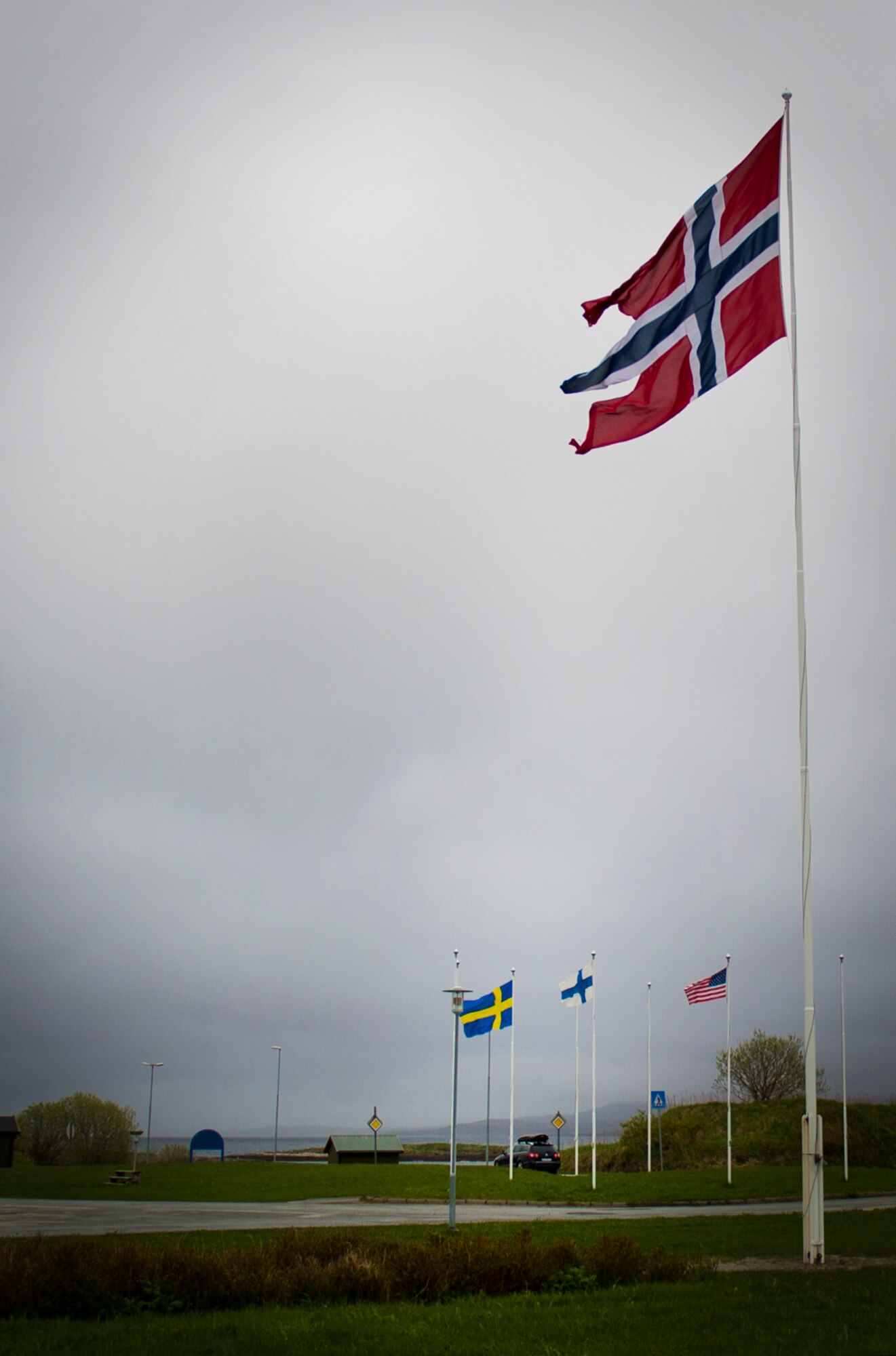 Flags representing the countries participating in the training exercise Arctic Fighter Meet 2016 were raised every day before the headquarters building, Bodø Main Air Station, Norway, May 24, 2016. Training regularly with other nations improves the U.S. Air Force's interoperability with fellow air forces and increases all NATO Allies and partner nations' overall ability to respond to crises together. (U.S. Air Force photo/Senior Airman Erin Babis)