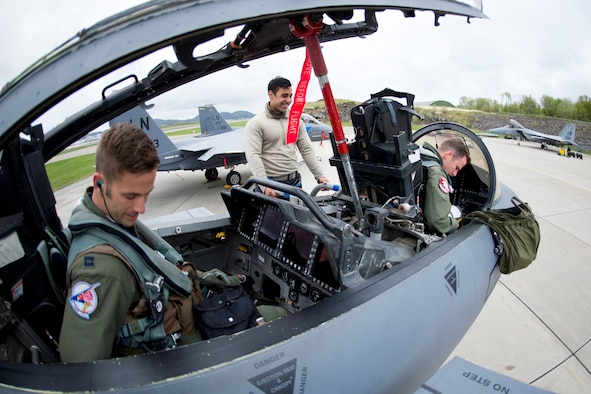 Senior Airman George Lopez, a 492nd Aircraft Maintenance Unit crew chief assigned to Royal Air Station Lakenheath, England, helps aircrew prepare for training exercise Arctic Fighter Meet 2016 at Bodø Main Air Station, Norway, May 25, 2016. Training regularly with other nations improves the U.S. Air Force's interoperability with fellow air forces and increases all NATO allies’ and partner nations' abilities to respond to crises together. (U.S. Air Force photo/Senior Airman Erin Babis)