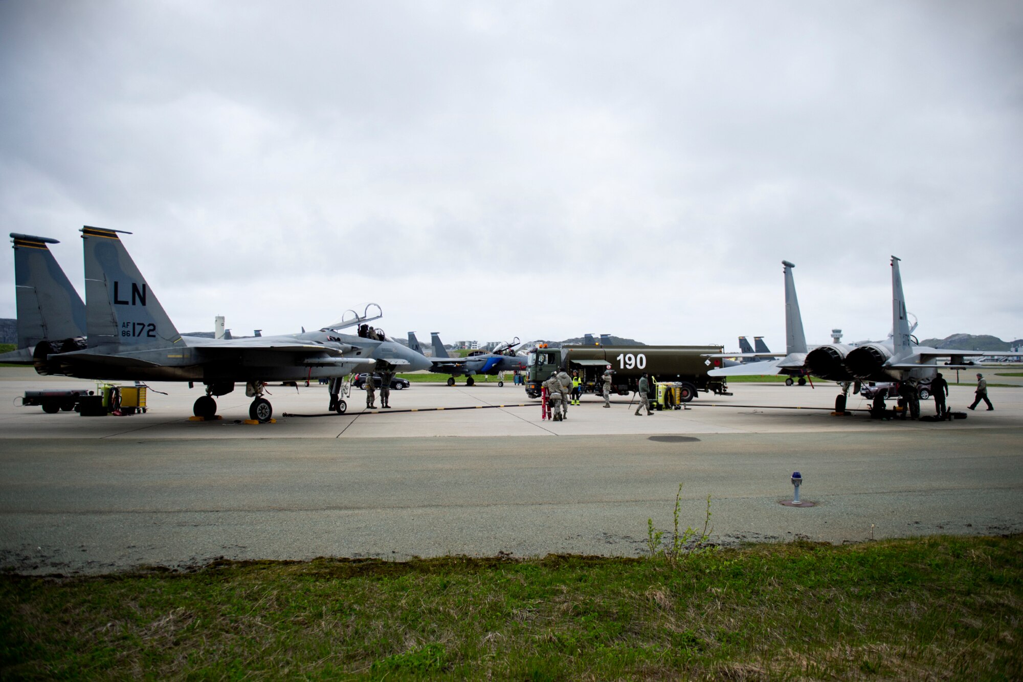 Royal Norwegian Air Force members refuel two 493rd Fighter Squadron F-15 C Eagles during training exercise Arctic Fighter Meet 2016, Bodø Main Air Station, Norway, May 25, 2016. This training exercise allowed forward-based U.S. Airmen and aircraft from RAF Lakenheath to train with NATO Allies and European partners, building on skill sets and improving every nation's ability to seamlessly work together. (U.S. Air Force photo/Senior Airman Erin Babis)