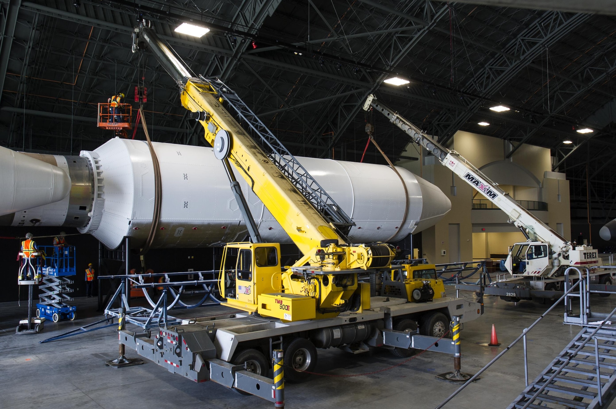 DAYTON, Ohio - Titan IVB stage two, and the payload fairing were both raised into their final position from 12-13 May, 2016. Maxim Crane Works and museum restoration crews worked together using two lifts to place the final
sections onto the stand. The impressive Titan IVB, with roots going back to the early days of U.S. Air Force and civil space launch, is significant as the museum looks to share the story of USAF and USAF-enabled space operations in its Space Gallery. The Titan IVB will be on display in the new fourth building at the National Museum of the U.S. Air Force which opens to the public on June 8. (U.S. Air Force photo by Ken LaRock)
