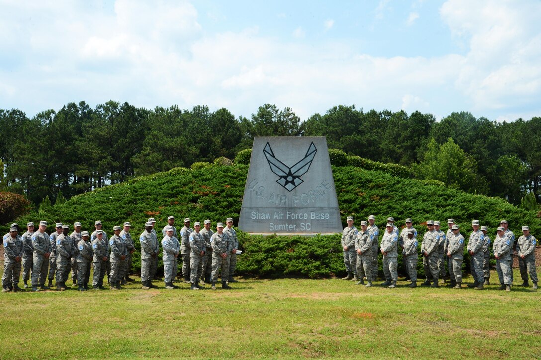 Team Shaw master sergeant selects stand in front of the Shaw Air Force Base, S.C., sign at Shaw AFB, May 26, 2016. This year the Air Force promoted 5,109 out of 21,504 eligible technical sergeants to master sergeant. (U.S. Air Force photo by Senior Airman Jonathan Bass)