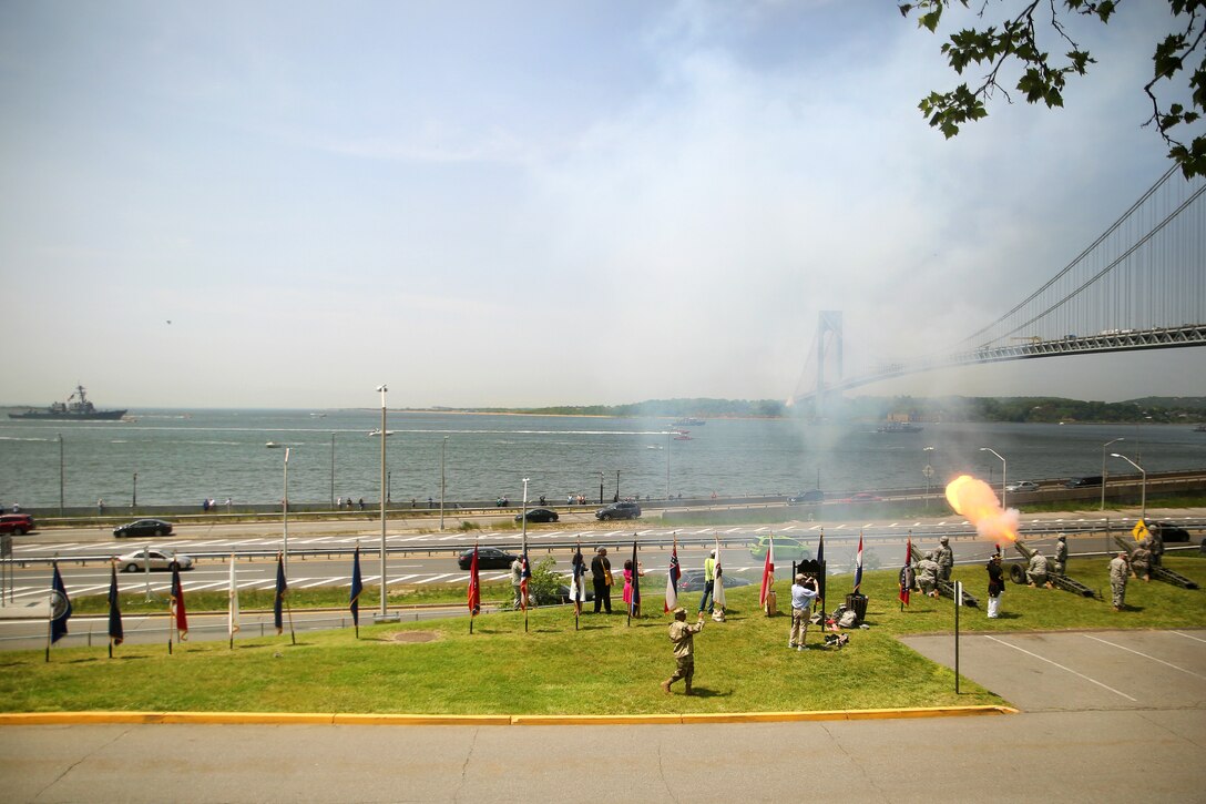 Soldiers fire cannons in a 21-gun salute to Navy ships as they enter New York City’s harbor during the parade of ships as part of Fleet Week New York in New York City, May 25, 2016. The soldiers are assigned to Fort Hamilton. Firing the cannons is an annual Army tradition to welcome the sea services to New York City. Marine Corps photo by Cpl. Joey Mendez