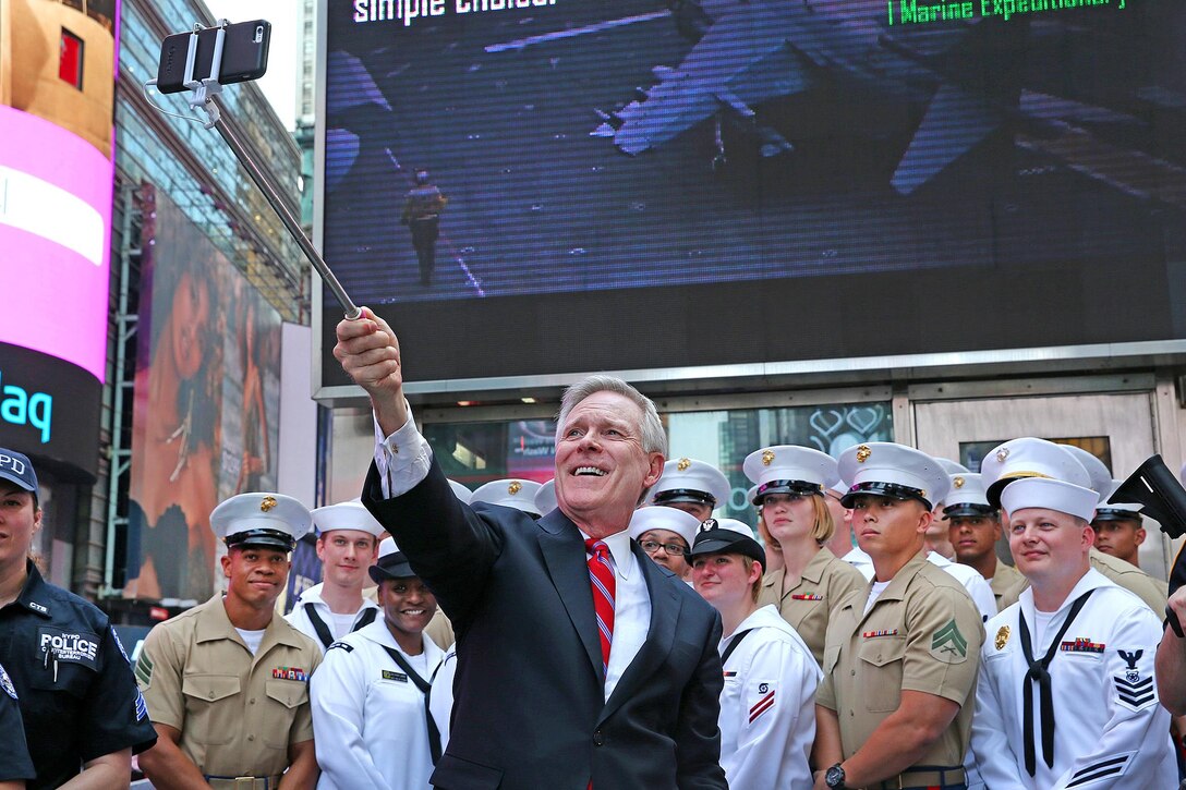 Navy Secretary Ray Mabus, center, takes a selfie with sailors and Marines at the Times Square Armed Forces Recruiting Station during Fleet Week New York in New York City, May 26, 2016. Navy photo by Petty Officer 1st Class Aidan P. Campbell