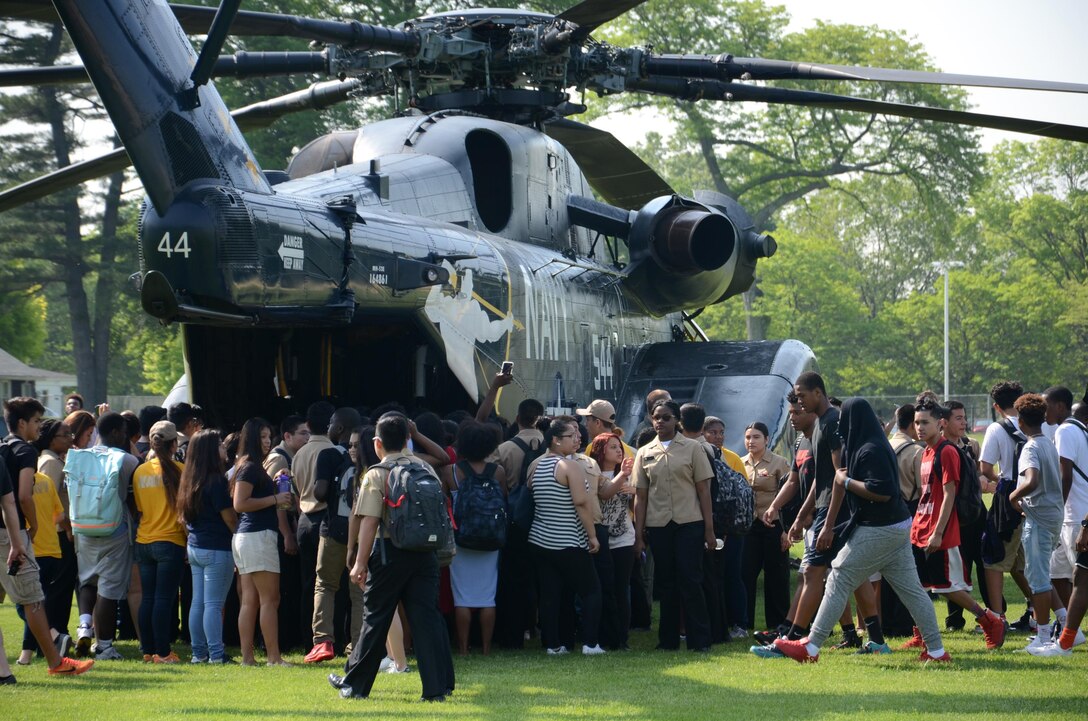 Students tour a display of an MH-53E Sea Dragon helicopter during Fleet Week New York in New York City, May 26, 2016. The helicopter crew is assigned to Helicopter Mine Countermeasures Squadron 14. Navy photo by Chief Petty Officer Travis Simmons