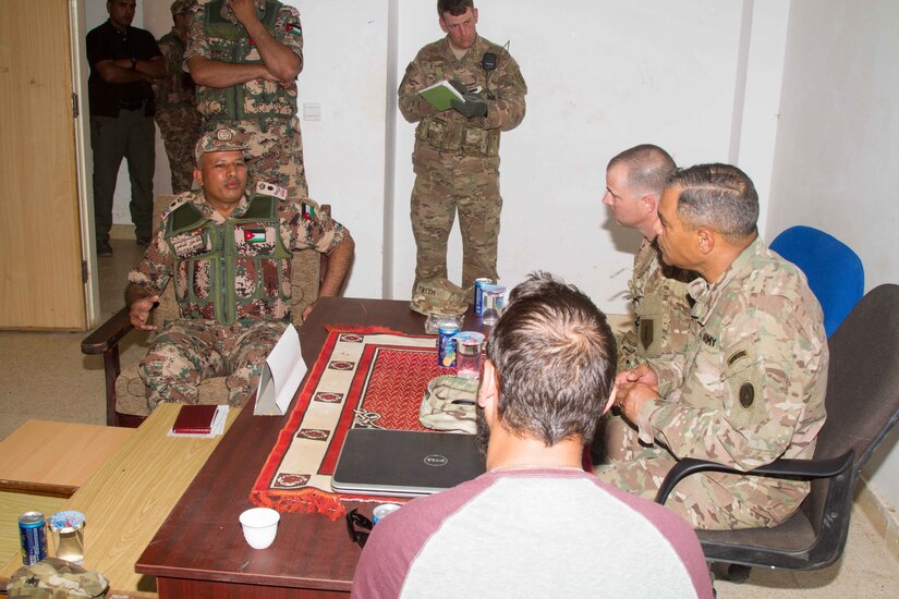 Jordan Army Lt. Col. Khaled M. Al-Mnaseer (left), the commander of the 6th King Ghazi Mechanized Infantry Battalion, briefs U.S. Army Lt. Gen. Michael X. Garrett (right), the commanding general of U.S. Army Central, about the partnership capabilities the Jordanian and U.S. forces have achieved over the past weeks at the Jordanian Training Center, Jordan, April 20. The USARCENT command team met with leaders of partner militaries throughout USARCENT’s area of responsibility to continue to build bilateral partnership ties.