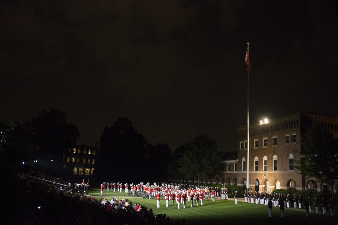 The United States Marine Drum and Bugle Corps performs during the Friday Evening Parade, May 27, 2016. The guest of honor for the parade was the Honorable Denis McDonough, White House chief of staff, and the hosting official was Gen. Robert B. Neller, commandant of the Marine Corps. (Official Marine Corps photo by Cpl. Chi Nguyen/Released)
