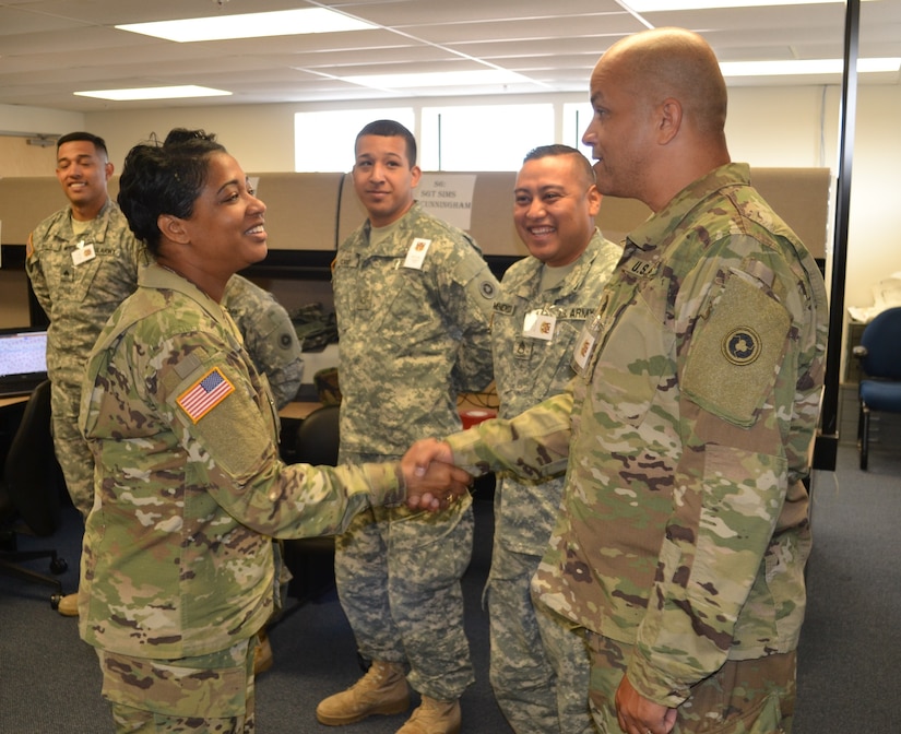 Col. Toni Glover, 650th Regional Support Group commanding officer, visited and greeted Soldiers and Lt. Col. Keven McKenzie, 483rd Transportation Battalion commander, in the 483rd TC BN tactical operations center, during the Operation Terminal Fury exercise May 20. The Operation Terminal Fury exercise tests the abilities of transportation companies with vessel assets to respond quickly to emergencies in their area of responsibility.