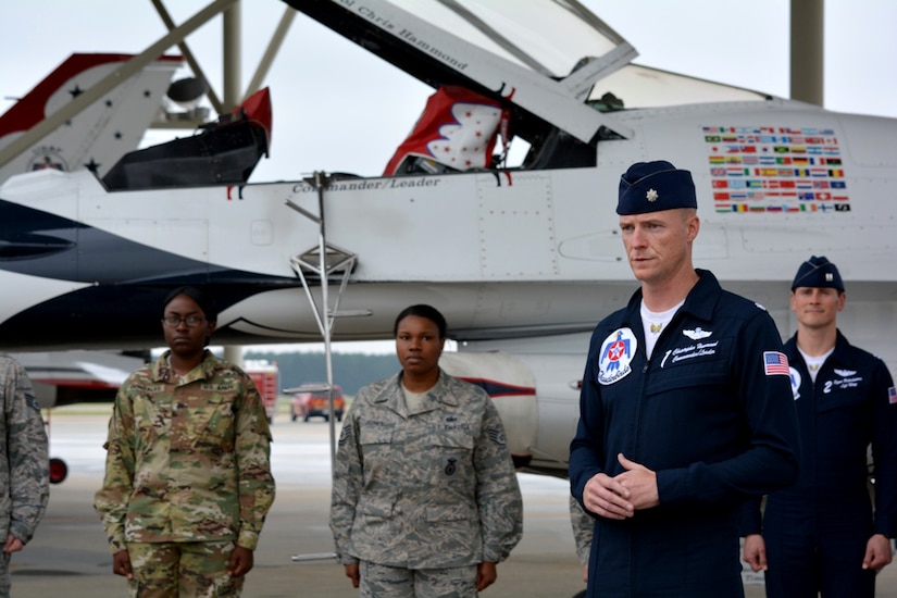 Lt. Col. Christopher Hammond, commander of the U.S. Air Force Thunderbirds, addresses attendees at a reenlistment ceremony during the Shaw Air Expo & Open house May 20, 2016 at Shaw Air Force Base, S.C. U.S. Army Soldier Sgt. Quenisha Gonzales reenlisted to serve an additional four years as a unit supply specialist.