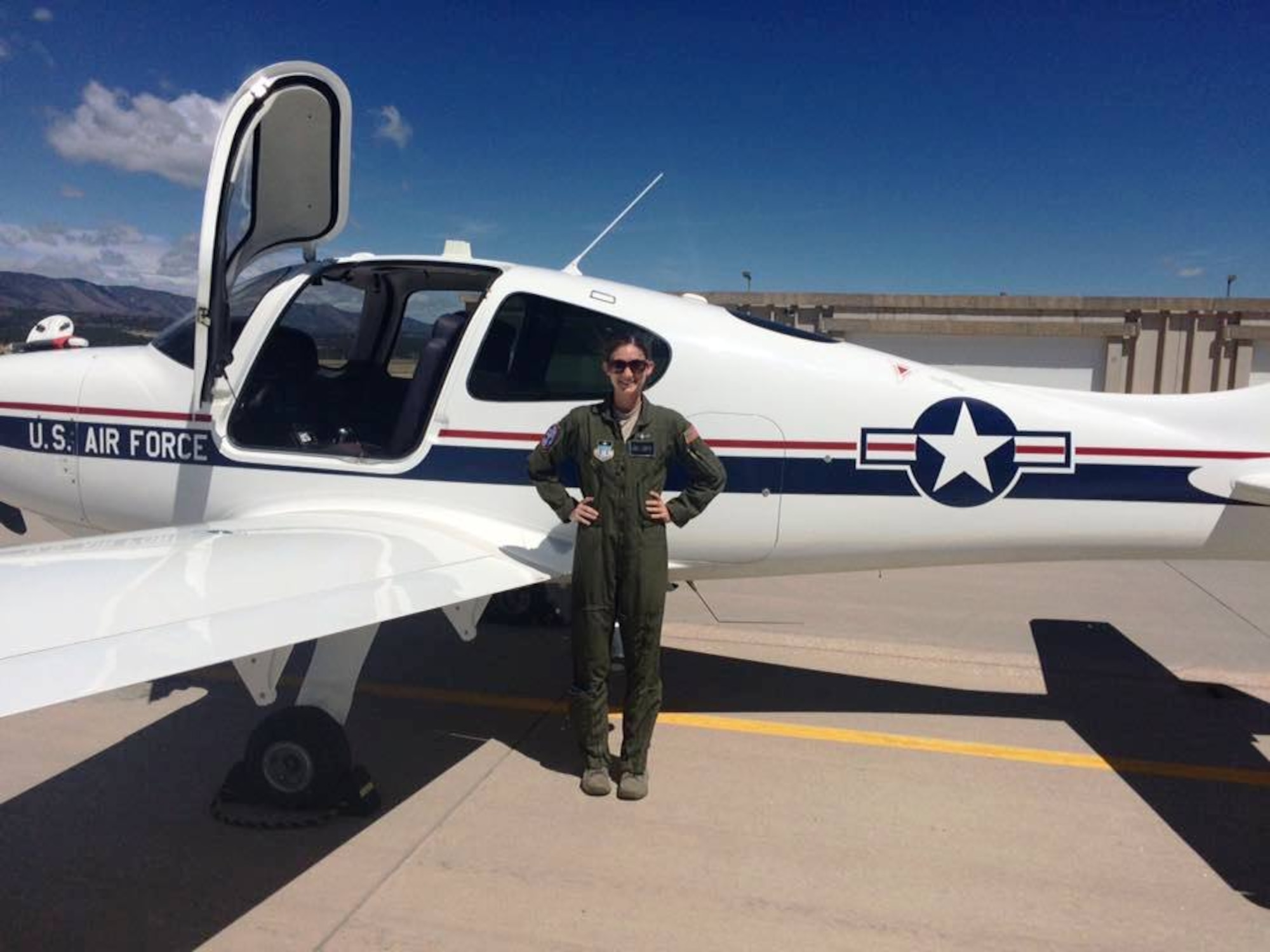 Cadet 2nd Class Emily Martin stands on the flightline at the U.S. Air Force Academy. She's enrolled in the Academy's Airmanship programs designed to teach cadets flying and leadership skills. Martin made her first solo flight this year.(U.S. Air Force photo)