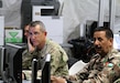 Maj. Gen. William Hickman, for U.S. Army Central deputy commanding general-operations, and Brig. Gen. Mekhled Suheim, Eager Lion 16 Combined Forces Land Component Command deputy commander, receive an operation and intelligence update brief during Eager Lion 16 at the Joint Training Center, Jordan, May 23, 2016. Eager Lion is an annual, bilateral exercise that took place taking place in the Hashemite Kingdom of Jordan between the Jordanian Armed Forces and the U.S. Military that is designed to strengthen relationships between the partner nations.