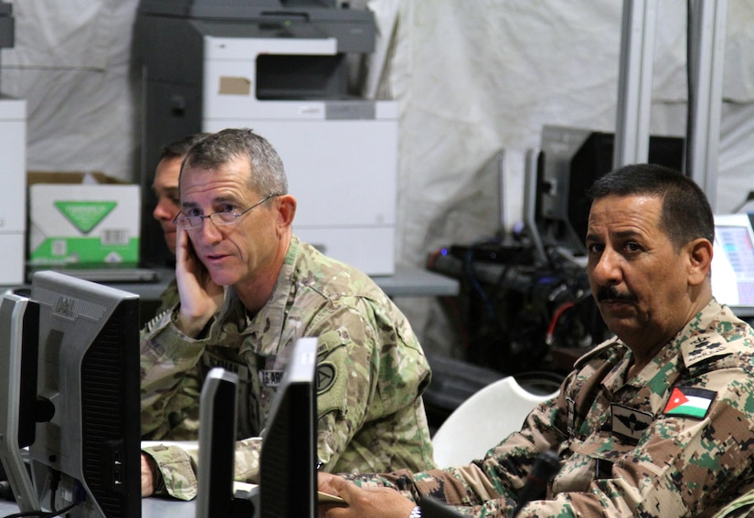 Maj. Gen. William Hickman, for U.S. Army Central deputy commanding general-operations, and Brig. Gen. Mekhled Suheim, Eager Lion 16 Combined Forces Land Component Command deputy commander, receive an operation and intelligence update brief during Eager Lion 16 at the Joint Training Center, Jordan, May 23, 2016. Eager Lion is an annual, bilateral exercise that took place taking place in the Hashemite Kingdom of Jordan between the Jordanian Armed Forces and the U.S. Military that is designed to strengthen relationships between the partner nations.