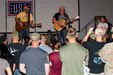 Jerrod Neimann (center), a country music artist, preforms for Soldiers of U.S. Army Central as part of the USO May Madness Tour on Camp Arifjan, Kuwait, May 18, 2016. The celebreties on the tour said they wanted to repay Servicemembers for their sacrifice and dedication to America.