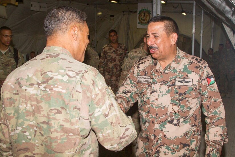 Jordan Army Brig. Gen. Mekhled Suheim, a military counselor at the Embassy of Jordan, greets Lt. Gen. Michael X. Garrett (left), U.S. Army Central commanding general, at the Contingency Command Post for Eager Lion 16 exercise at the Joint Training Center, Jordan, May 24, 2016. Eager Lion is an annual two-week interoperability exercise that aims to increase the partnership ties between the U.S. and Jordanian militaries.