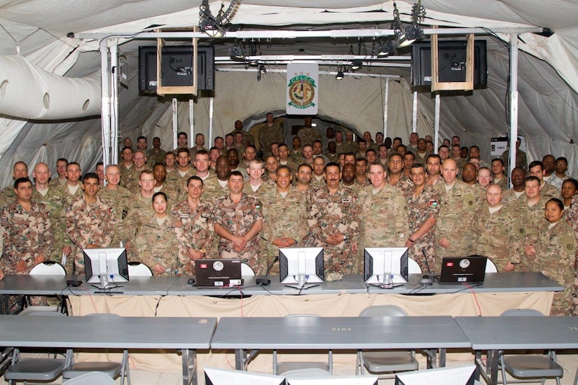 Lt. Gen. Michael X. Garrett, U.S. Army Central commanding general, and the staff of the Contingency Command Post for Eager Lion 16 gather for a group photo at the Joint Training Center, Jordan, May 24, 2016. Eager Lion is an annual two-week interoperability exercise that aims to increase the partnership ties between the U.S. and Jordanian militaries.