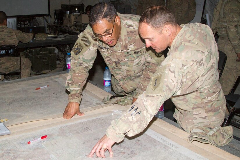 Col. Miles Brown, the commander of 2nd Armored Brigade Combat Team, 1st Infantry Division, explains the battle plan of the combined arms live fire exercise for Eager Lion 16 to Lt. Gen. Michael X. Garrett, U.S. Army Central commanding general, at the Joint Training Center, Jordan, May 24, 2016. Eager Lion is an annual two-week interoperability exercise that aims to increase the partnership ties between the U.S. and Jordanian militaries.