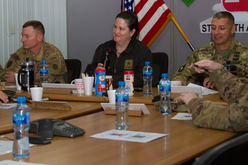 The Honorable Katherine Hammack, the assistant secretary of the Army for installations, energy and environment, Brig. General John S. Laskodi, with the Department of the Army Headquarters logistics office and Col. Jeff Stewart, commander of Area Support Group-Kuwait, prepare for a briefing in a conference room at the Kuwait Naval Base, Kuwait, May, 24, 2016. The delegation received a brief on partnership opportunities with Kuwaiti military and installation operations before visiting sites on the base.