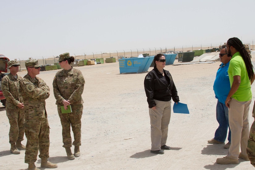 The Honorable Katherine Hammack, the assistant secretary of the Army for installations, energy and environment, listens to Reginald Coleman and Thomas Frank, with the Environment Recycling Center at Camp Buehring, Kuwait, May, 24, 2016. The ERC facilitates the recycling of plastic, paper and metal products.