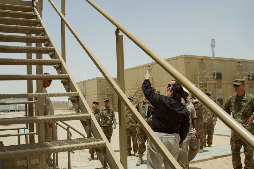 The Honorable Katherine Hammack, the assistant secretary of the Army for installations, energy and environment, takes a look at newly built modular energy efficient structures on Camp Buehring, Kuwait, May, 24, 2016. Construction on the units are about 85 percent completed and some units are equipped with solar roof panels, providing self-sustaining energy.
