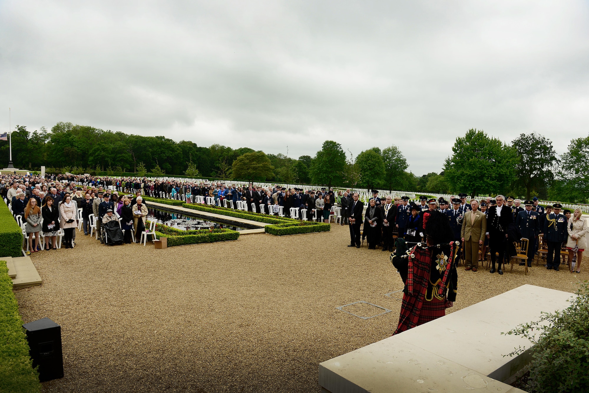 Hundreds gathered to honor the memory of the thousands of U.S. Soldiers, Sailors, Marines and Airmen who made the ultimate sacrifice in the service of their nation on Memorial Day, May 30, at Madingley American Cemetery in Cambridge, England. Attendees watched as wreaths were placed at the Wall of the Missing, while U.S. Air Force Honor Guardsmen conducted a twenty-one gun salute, followed by the playing of taps to honor the fallen. (U.S. Air Force photo/ Tech Sgt. Matthew Plew)