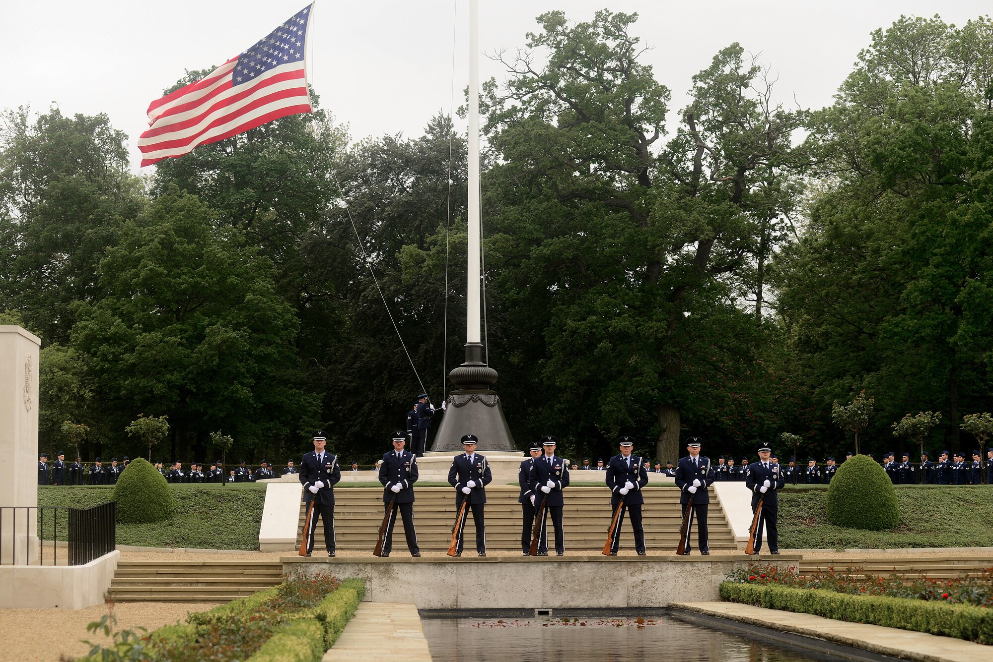 Hundreds gathered to honor the memory of the thousands of U.S. Soldiers, Sailors, Marines and Airmen who made the ultimate sacrifice in the service of their nation on Memorial Day, May 30, at Madingley American Cemetery in Cambridge, England. Attendees watched as wreaths were placed at the Wall of the Missing, while U.S. Air Force Honor Guardsmen conducted a twenty-one gun salute, followed by the playing of taps to honor the fallen. (U.S. Air Force photo/ Tech Sgt. Matthew Plew)