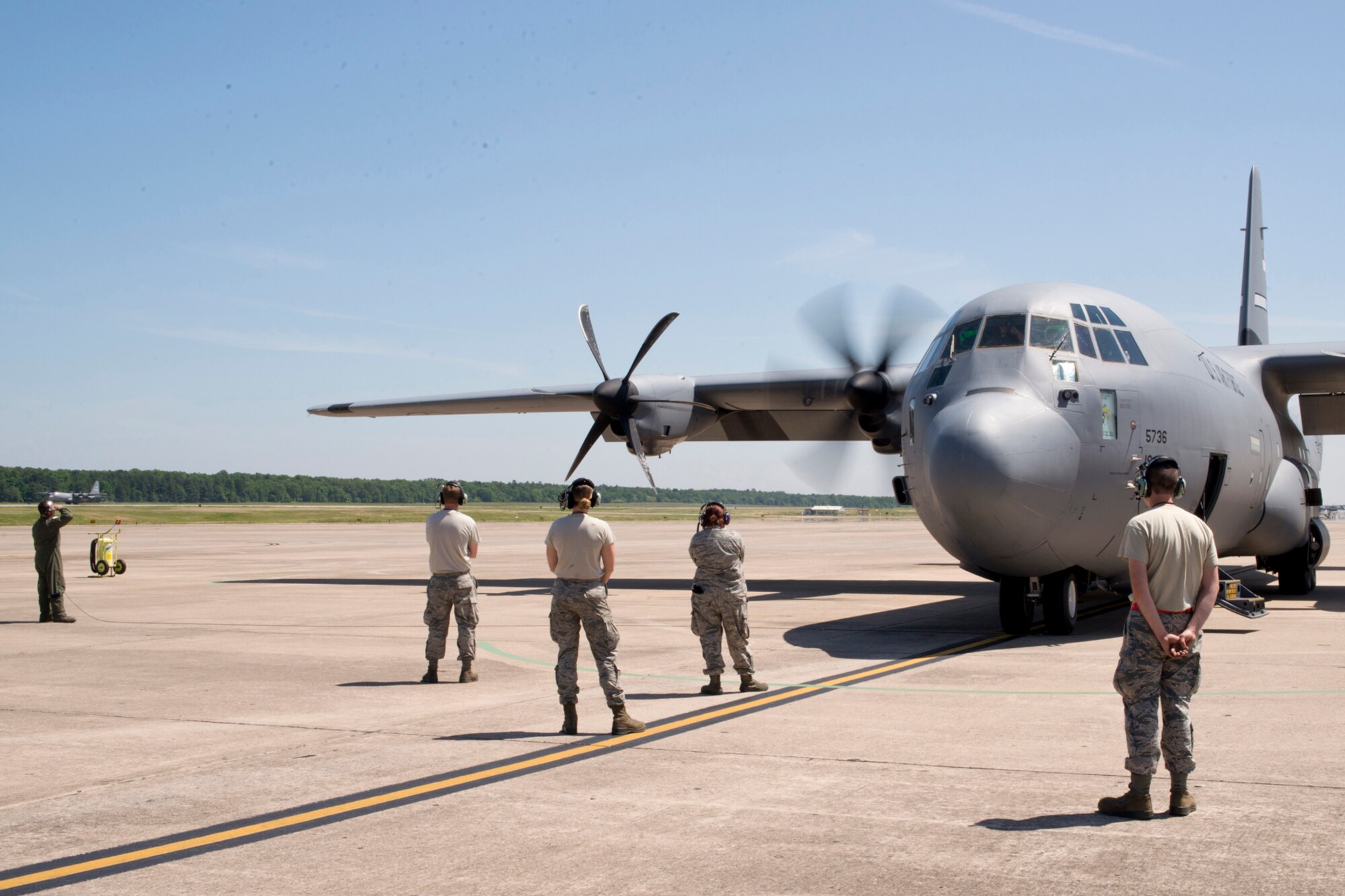 (Far Left) U.S. Air Force Reserve Tech. Sgt. Nick Crawford, loadmaster, 327th Airlift Squadron, looks for problems during the engine start of a C-130J at Little Rock Air Force Base, Ark., May 13, 2016. This marks the first flight of a C-130J aircraft manned by an all Reserve aircrew since the 913th Airlift Group’s transition from the “H” to the “J” model. (U.S. Air Force photo by Master Sgt. Jeff Walston/Released)
