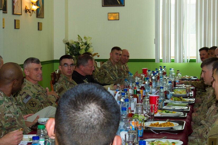 Lt. Gen. Robert L. Caslen Jr., the superintendent of the United States Military Academy at West Point, speaks to graduates of West Point during lunch on Camp Arifjan, Kuwait, May 28, 2016. Caslen and members of the school’s athletic department visited with graduates from West Point to get feedback from their time at the academy and how it affects the work they now do in the Army.