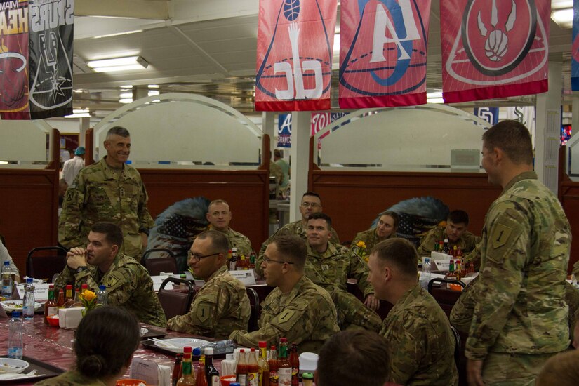 Lt. Gen. Robert L. Caslen Jr., the superintendent of the United States Military Academy at West Point, speaks with 2nd Lt. Daniel Engstrom, an intelligence officer, with 2nd Battalion, 70th Armored Regiment, 2nd Armored Brigade Combat Team, 1st Infantry Division and other graduates of West Point during dinner at Camp Buehring, Kuwait, May 28, 2016. Caslen and members of the school’s athletic department visited with graduates from West Point to get feedback from their time at the academy and how it affects the work they now do in the Army.