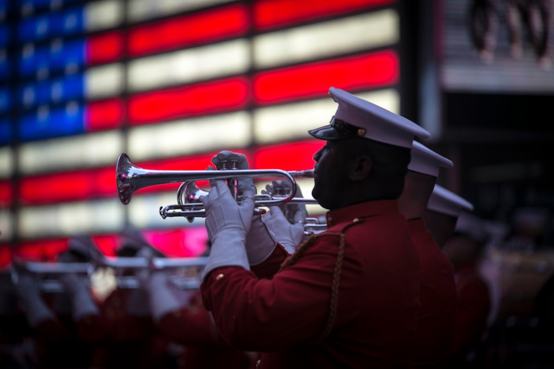 A Marine plays the trumpet during the Commandant’s Own performance at Times Square in New York, May 28, 2016. U.S. Marines and sailors are in New York for Fleet Week to interact with the public, demonstrate capabilities and teach the people of New York about America's sea services. (U.S. Marine Corps photo by Cpl. Jonah Lovy/Released)
