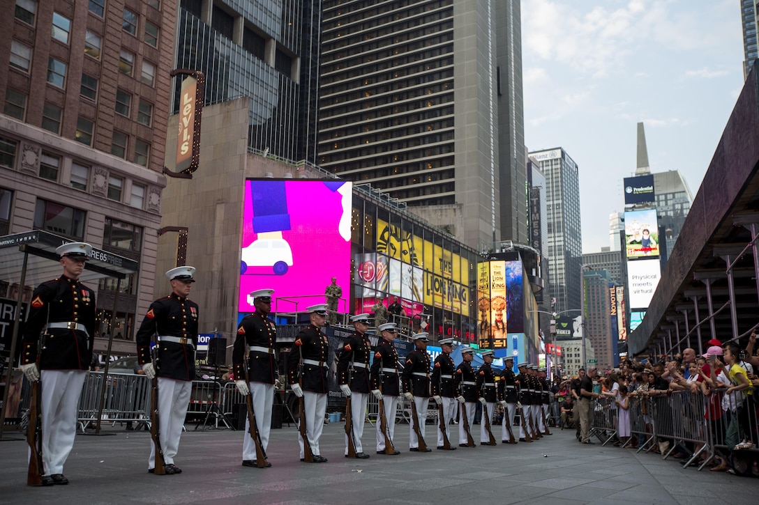 Members of the Marine Corps Silent Drill Platoon perform at Times Square in New York during Fleet Week, May 28, 2016. U.S. Marines, sailors and Coast Guardsmen are in New York to interact with the public, demonstrate capabilities and teach the people of New York about America’s sea services. (U.S. Marine Corps photo by Cpl. Todd F. Michalek/Released)