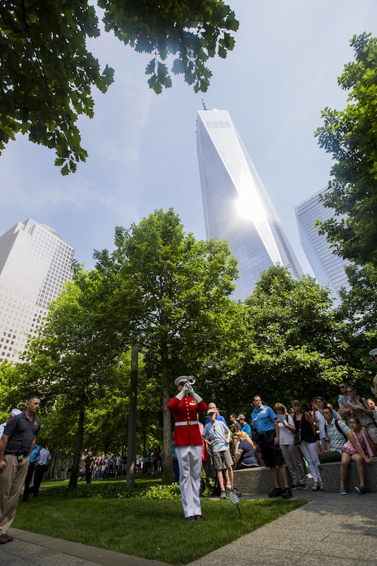 A U.S. Marine with The Commandant's Own plays taps at the 9/11 Memorial in New York, May 29, 2016. U.S. Marines, sailors and Coast Guardsmen are in New York to interact with the public, demonstrate capabilities and teach the people of New York about America's sea services. (U.S. Marine Corps Photo by Sgt. Rebecca L. Floto, 2D MARDIV Combat Camera/Released)