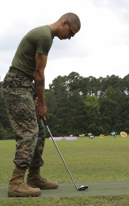 A Marine swings his club during the Stroke of Luck golf challenge aboard Marine Corps Air Station Beaufort May 18. The Marines are participating in the contest put together by Marine Corps Community Services for a chance to win a complimentary round of golf at the Legends Golf Course aboard Marine Corps Recruit Depot Parris Island. The Marines are with Marine Aircraft Group 31.