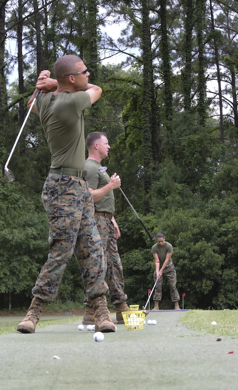 Marines practiced their swing during the Stroke of Luck golf challenge aboard Marine Corps Air Station Beaufort May 18. The Marines are participating in the contest put together by Marine Corps Community Services for a chance to win a complimentary round of golf at the Legends Golf Course aboard Marine Corps Recruit Depot Parris Island. The Marines are with Marine Aircraft Group 31.