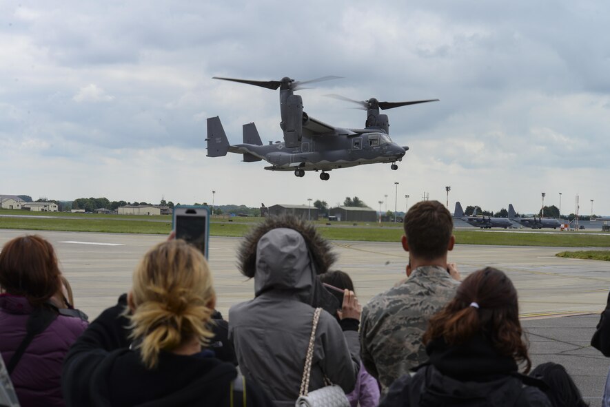 Airmen and their families watch a CV-22 Osprey move into position for a fast-rope demonstration during the 352nd Special Operation Wing Spouses’ Day, May 26, 2016, on RAF Mildenhall, England. Along with the fast-rope demonstration, Airmen and their families were able to view various displays. (U.S. Air Force photo by Staff Sgt. Micaiah Anthony/Released)