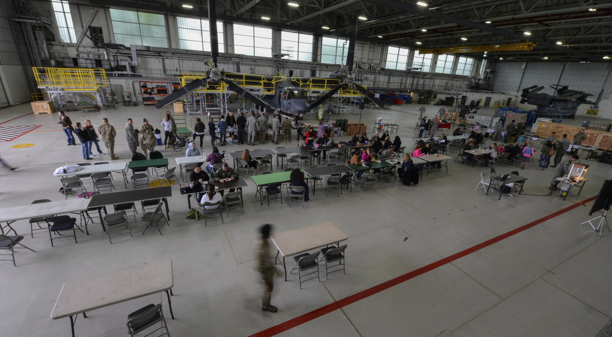 Airmen and their families enjoy lunch during the 352nd Special Operations Wing Spouses’ Day, May 26, 2016, on RAF Mildenhall, England. The event enabled participants to learn about the wing’s mission and capabilities. (U.S. Air Force photo by Staff Sgt. Micaiah Anthony/Released)
