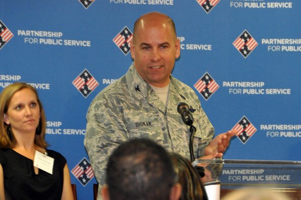 910th Airlift Wing Commander Col. James Dignan makes a point to an audience of federal agency staff members during his talk at the inaugural Delivering Outcomes to Communities (DOC) event hosted by the Partnership for Public Service (PPS) here, May 9, 2016. During the event members of the Air Force Reserve’s 910th Airlift Wing, based at Youngstown Air Reserve Station, Ohio, shared their experiences utilizing military training programs to aid communities across the country. (U.S. Air Force photo by Master Sgt. Bob Barko Jr.) 