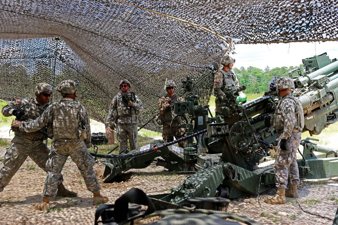 Soldiers load an M777 howitzer before firing during a joint air attack team exercise at Fort Stewart, Ga., May 22, 2016. Army photo by Spc. Scott Lindblom