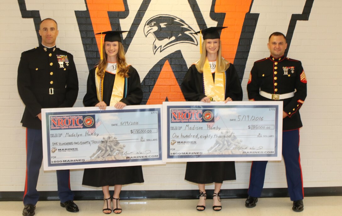 From left to right, U.S. Marine Corps Captain Brett J. Warming, the executive officer of Marine Corps Recruiting Station Raleigh, North Carolina, Madelyn M. Hamby and Madison N. Hamby, West Wilkes High School students, and Sgt. John F. Sanderson, a recruiter with Recruiting Station Raleigh, pose for a photo following an awards ceremony at West Wilkes High School in Wilkesboro, North Carolina, May 19, 2016. Madison and Madelyn received the Naval Reserve Officers Training Corps scholarship for their athleticism, academics and leadership capabilities. (U.S. Marine Corps photo by Sgt. Dwight A. Henderson/Released) 