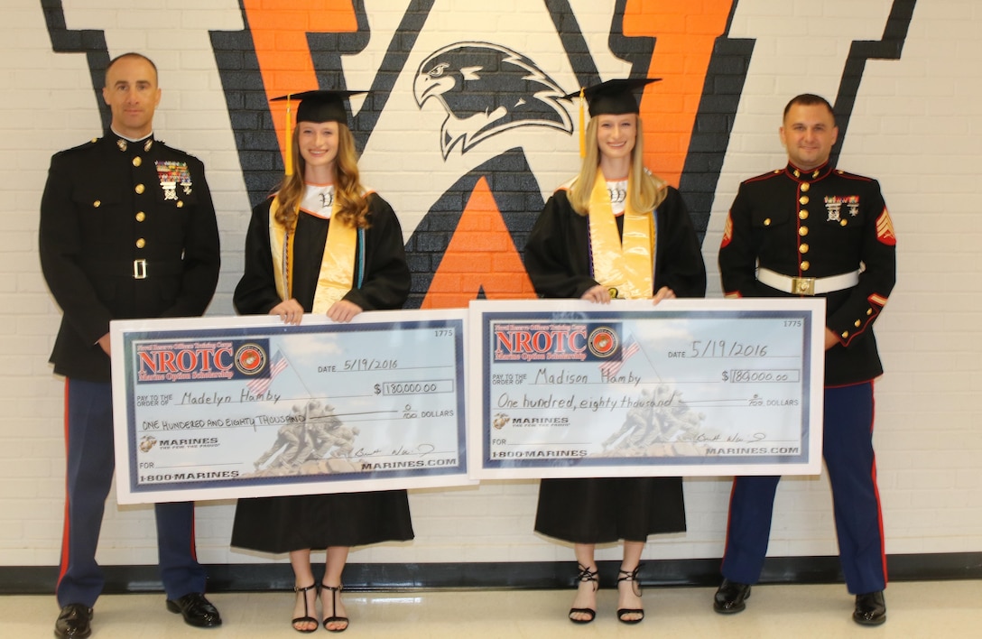 From left to right, U.S. Marine Corps Captain Brett J. Warming, the executive officer of Marine Corps Recruiting Station Raleigh, North Carolina, Madelyn M. Hamby and Madison N. Hamby, West Wilkes High School students, and Sgt. John F. Sanderson, a recruiter with Recruiting Station Raleigh, pose for a photo following an awards ceremony at West Wilkes High School in Wilkesboro, North Carolina, May 19, 2016. Madison and Madelyn received the Naval Reserve Officers Training Corps scholarship for their athleticism, academics and leadership capabilities. (U.S. Marine Corps photo by Sgt. Dwight A. Henderson/Released) 
