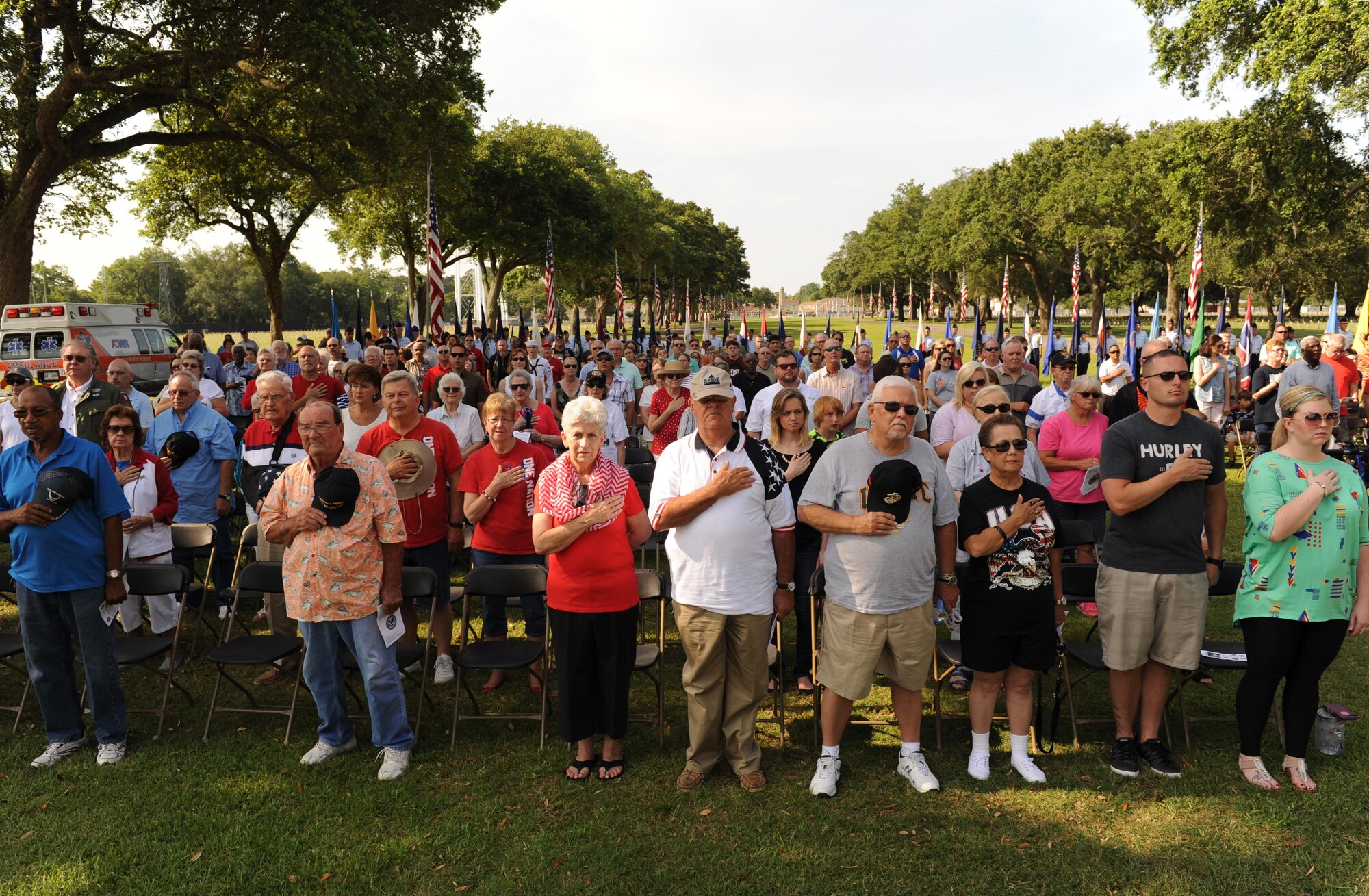Local veterans and family members recite the Pledge of Allegiance during a Memorial Day Ceremony May 30, 2016, Biloxi, Miss. Keesler Air Force Base personnel also attended the event at the Biloxi National Cemetery to honor and remember the lives of fallen heroes of the U.S. military. (U.S. Air Force photo by Kemberly Groue)