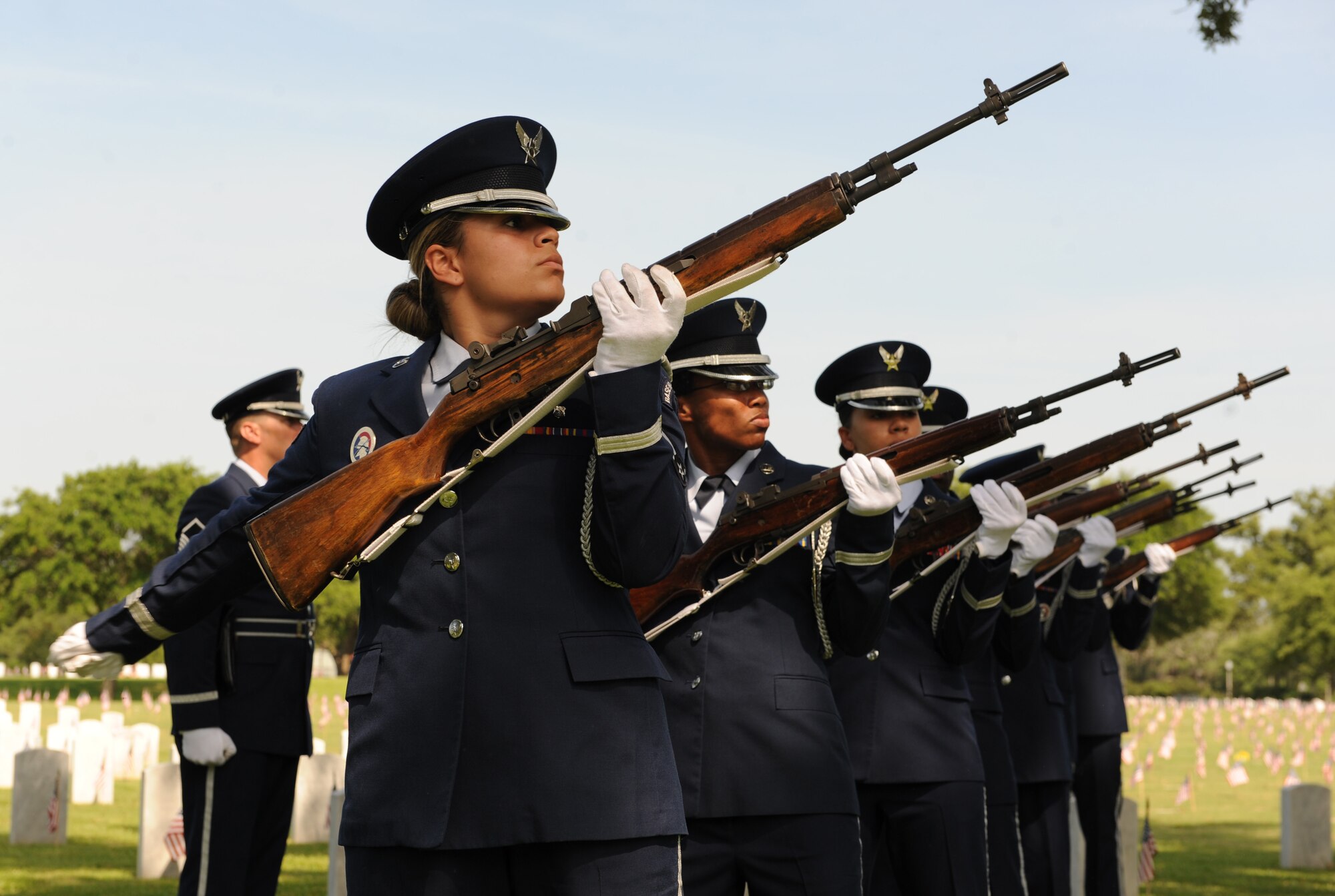 Members of the Keesler Honor Guard perform military honors during a Memorial Day Ceremony May 30, 2016, Biloxi, Miss. Local veterans, family members and Keesler Air Force Base personnel attended the event at the Biloxi National Cemetery to honor and remember the lives of fallen heroes of the U.S. military. (U.S. Air Force photo by Kemberly Groue) 