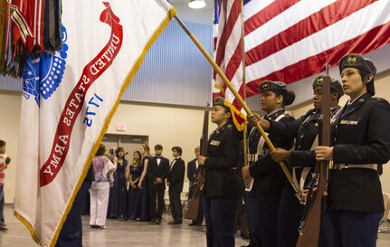 The Mountain View High School JROTC Color Guard present the Colors at a high school award ceremony that was held at the 83rd Military Police Company in El Paso, Texas on May 21, 2016. The ceremony recognized over 80 high school seniors for their decision to join the Army after school graduation.  (U.S. Army photo by Spc. Stephanie Ramirez) 