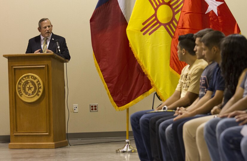 Ret. Command Sgt. Maj. Lance P. Lehr, the guest speaker at a high school award ceremony that was held at the 83rd Military Police Company in El Paso, Texas on May 21, 2016, addresses the graduating seniors about the importance of education both in the military and on the civilian side. The ceremony recognized over 80 high school seniors for their decision to join the Army after school graduation.  (U.S. Army photo by Spc. Stephanie Ramirez) 