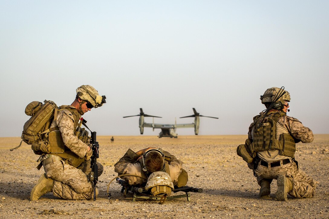 Marines provide security before moving a simulated casualty during a Tactical Recovery of Aircraft and Personnel exercise at an undisclosed location in Southwest Asia, May 23, 2016. The Marines are assigned to 2nd Battalion, 7th Marine Regiment, Special Purpose Marine Air Ground Task Force Crisis Response Central Command. Marine Corps photo by Cpl. Trever Statz
